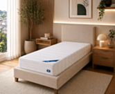 Matelas Sensospring 90x200 cm Oli posé sur un lit 1 personne dans une chambre moderne – confort équilibré à ressorts ensachés